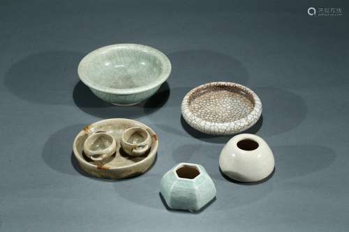 A set of five glazed ceramic objects