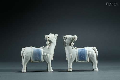 A pair of white and blue glaze horses