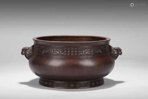 A large bronze censer with two beast handles