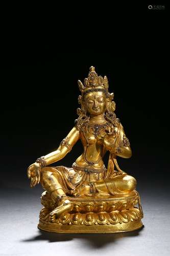 A gilt-bronze statue of tara