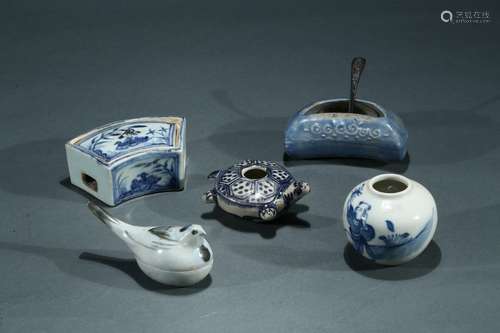 A set of five blue and white ceramic objects