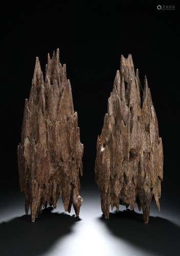 A pair of agarwood mountain boulders