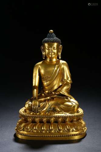 A gilt bronze figure of Shakyamuni