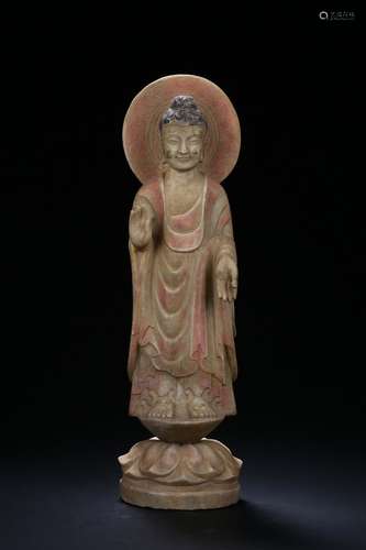 A stone carved standing bodhisattva