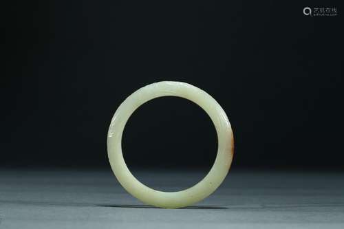 A yellow celadon jade bangle