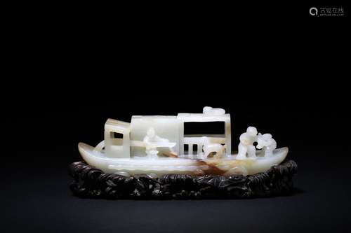 A well-carved white jade sampan