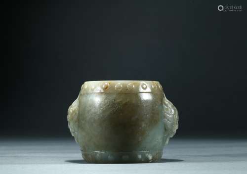 A celadon jade carved 'drum' paper weight