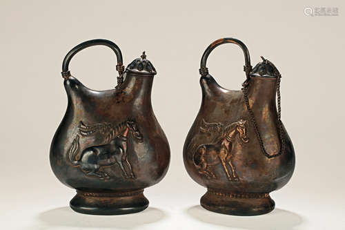 PAIR OF SILVER ALLOY CAST OIL CANISTERS