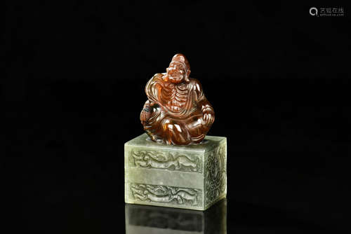 Amber carved Arhat with carved Shoushan stone base