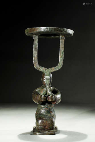 Archaic bronze 'Person' lamp