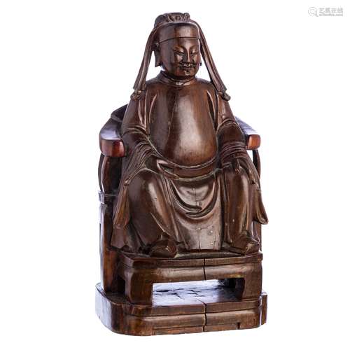 Wooden sculpture of a dignitary