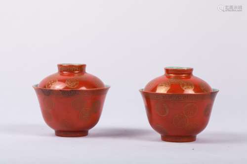 PAIR OF CHINESE CORAL GLAZED TEA CUPS