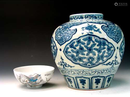 One Chinese blue and white jar and a dragon bowl.