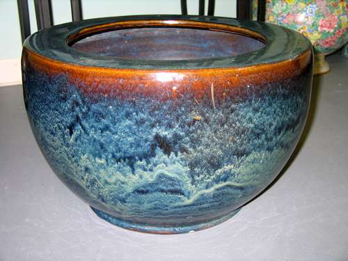 A large Chinese pottery fish bowl.