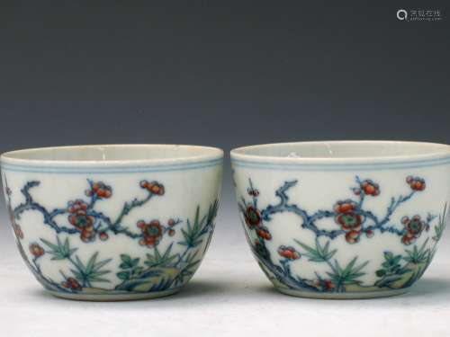 A pair of Chinese doucai porcelain tea cups. Yongzheng Mark and possibly of the period.