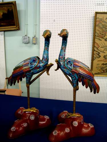 A pair of Chinese antique cloisonne cranes.