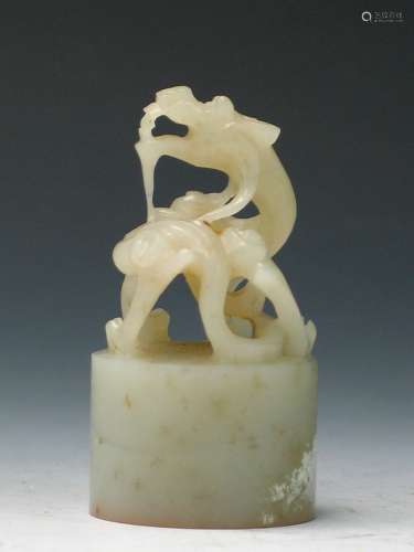 Chinese carved white jade dragon seal.