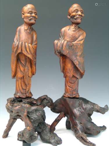 A pair of Chinese wood carving of luohans.