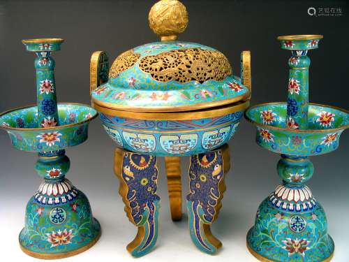 Chinese antique cloisonne incense burner and a pair of candle holders.