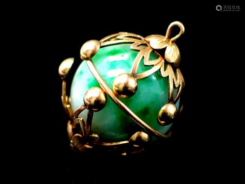 14K and jadeite pendant.