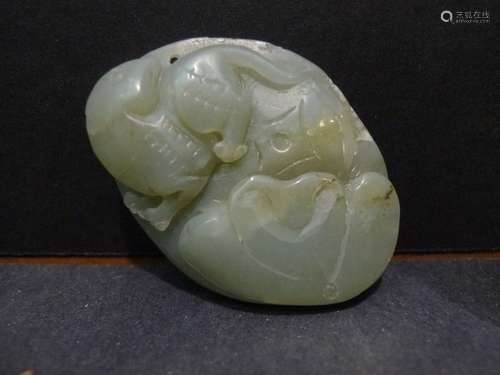 CHINESE CARVED HETIAN JADE PEBBLE PENDANT