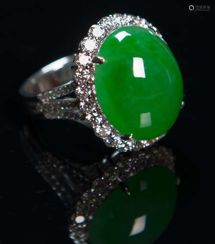 A Translucent Bright Green Jadeite Cabochon Ring Mounted With Diamond