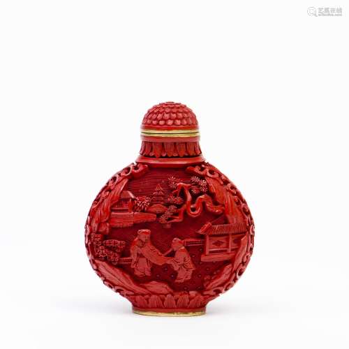 A RED CARVED LACQUERED SNUFF BOTTLE