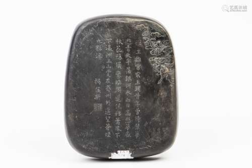 AN INK STONE WITH CHINESE ENGRAVING