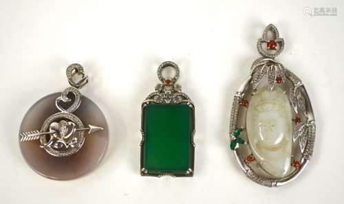 Three Chinese Jade Silver Mounted Pendants