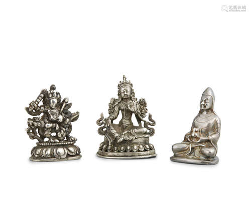 An assembled group of three silver Buddhist figures Tibet and Nepal, 19th century and earlier