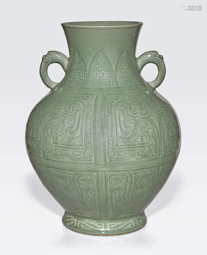 A large celadon glazed vase with incised decoration Qianlong six-character mark and of the period