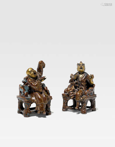 A pair of polychrome and gilt decorated porcelain luohan Republic Period