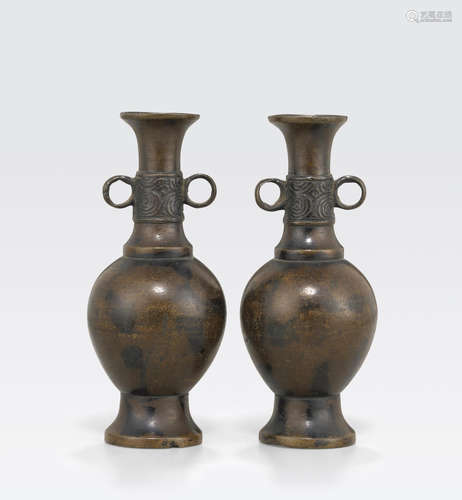 A pair of miniature bronze baluster vases 17th century