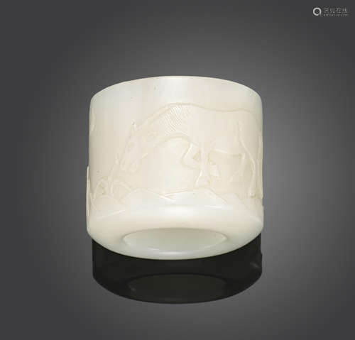 A white jade archer's ring with carved decoration Qing dynasty