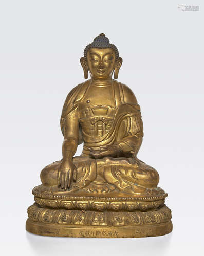 A repoussé gilt copper alloy figure of Buddha Incised Qianlong seven-character mark and of the period