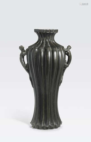 A tall bronze baluster vase with opposing dragon handles 17th/18th century