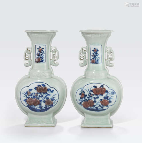 A pair of celadon glazed vases with underglaze blue and copper red decoration 18th/19th century