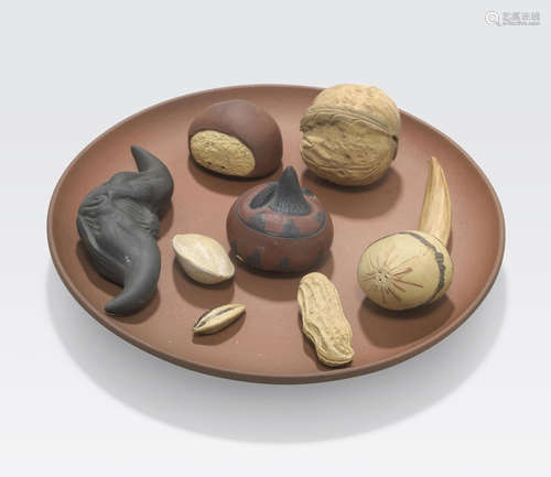 A group of eight Yixing nuts, fruit and seeds