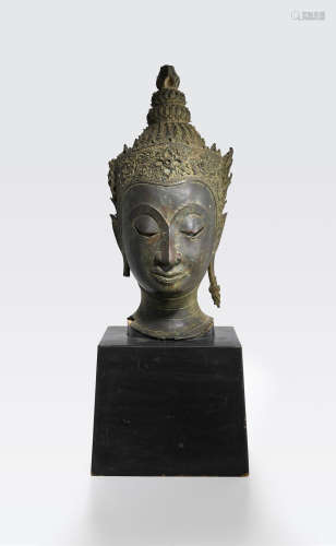 A copper alloy head of a Crowned Buddha Thailand, Ayutthaya period, late Sukhothai style, 17th century