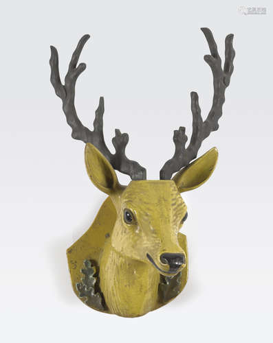 A polychrome enameled wall plaque in the shape of a deer head Republic period