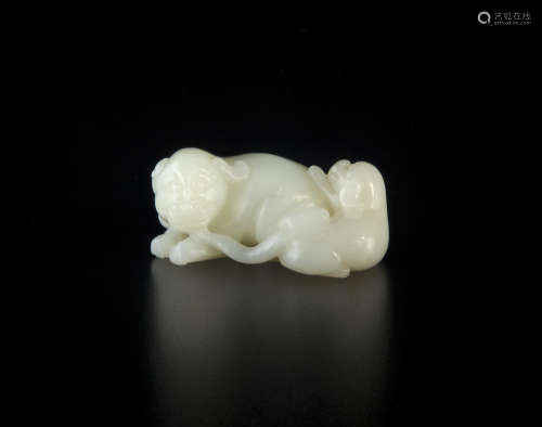 A carved jade dog and pup group