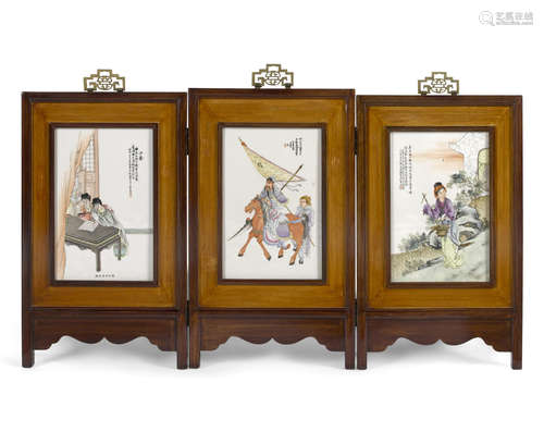 A three-panel polychrome enameled porcelain table screen