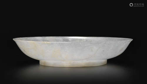 A translucent grayish-white jadeite dish