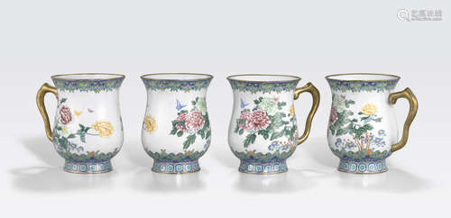 A set of four enameled metal mugs