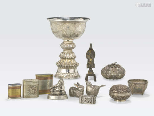 A group of nine Asian silver and mixed metal miniature containers