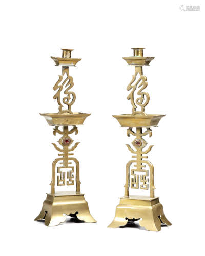 A pair of brass Fu Shou candle stands Republic period