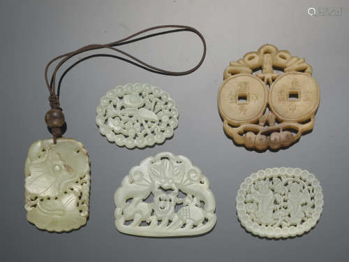 A group of five jade pendants