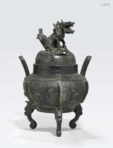 A cast bronze covered tripod censer Qing dynasty