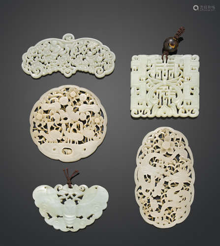 A group of five reticulated jade plaques