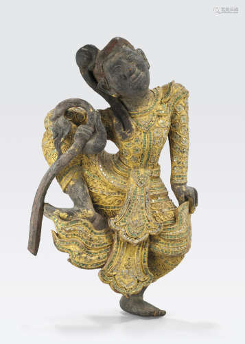 A glass inlaid gilt figure of a celestial Thailand or Myanmar, 19th/20th century